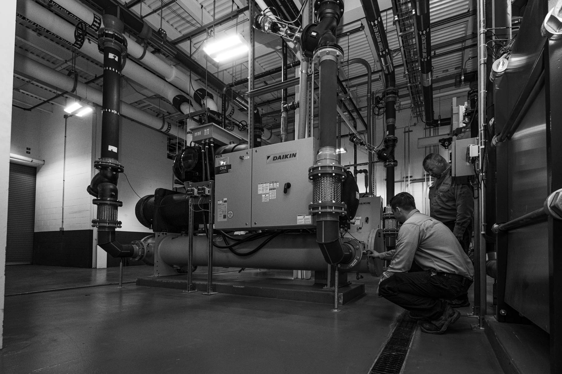 technicians checking unit
